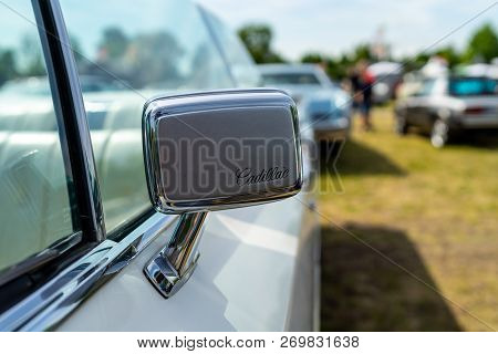 Paaren Im Glien, Germany - May 19, 2018: Rearview Mirror Of A Full-size Luxury Car Cadillac De Ville