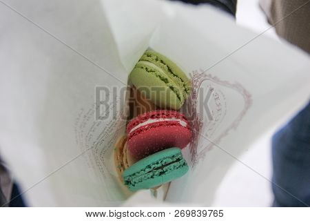 Paris, France - April 2016: Colorful Macarons Cookies From Laduree Store In Paper Bag In The Charles