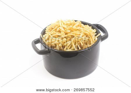 Potato Sticks In A Small Pan. Batata Palha Isolated On White Background
