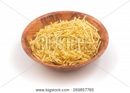 Potato Sticks In A Wooden Bowl. Batata Palha Isolated On White Background