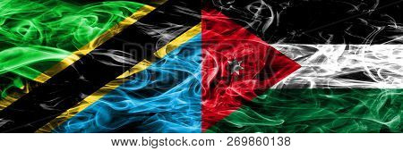 Tanzania Vs Jordan, Jordanian Smoke Flags Placed Side By Side. Thick Colored Silky Smoke Flags Of Ta