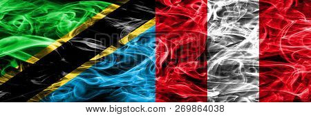Tanzania Vs Peru, Peruan Smoke Flags Placed Side By Side. Thick Colored Silky Smoke Flags Of Tanzani
