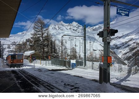 Zermatt, Switzerland - March 20, 2018: A Train Of Traditional Track Railway Gornergratbahn Is Approa