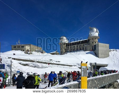 Zermatt, Switzerland - March 20, 2018: Ski Tourists At Gornergrat Station With Observatory