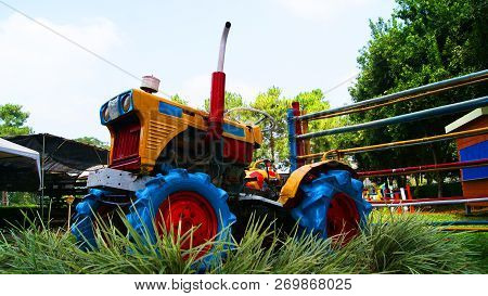 Old Vintage Tractor / Colorful Tractor  Stand In The Garden Farm - Agriculture Tractor For Plow On H