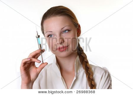 Doctor keeps in the hands of the syringe