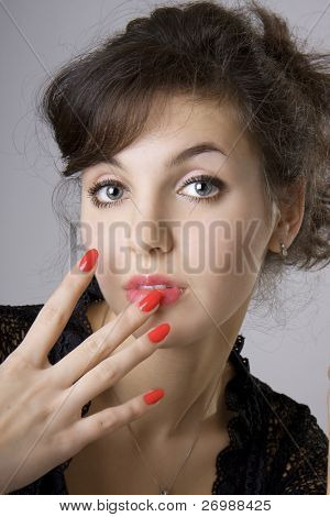 Girl with bright red nails