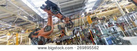 Automated Assembly Process Of Cars By Robots. Automotive Production Line. Long Format. Wide Frame