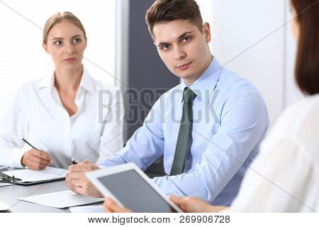 Group Of Business People Or Lawyers Discussing  Terms Of Transaction In Office. Colleagues Working A