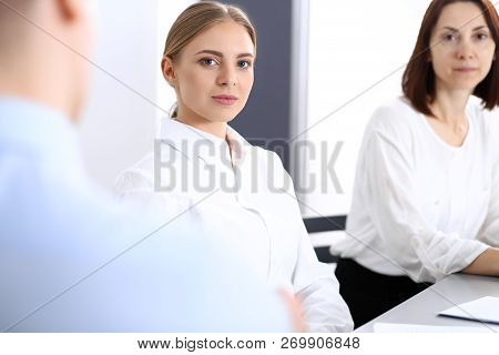 Group Of Business People Or Lawyers Discussing  Terms Of Transaction In Office. Colleagues Working A