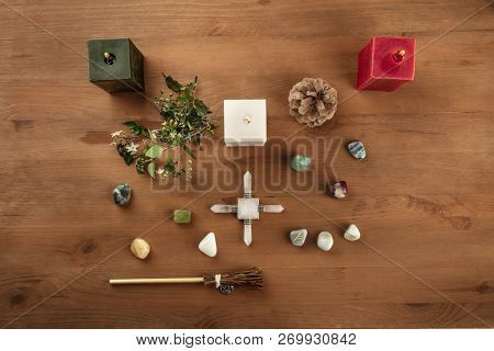 Green Magic. An Overhead Photo Of A Wicca Altar With Candles, Crystal Stones, And Norse Runes, With 
