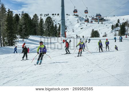 Kreischberg, Murau, Austria - March 15, 2017: Many Skiers Ride In Alps At Sunny Winter Day. Cable Ca