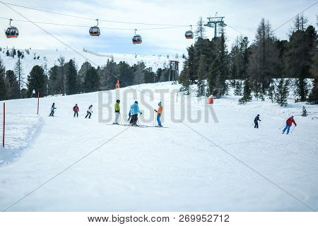 Kreischberg, Murau, Austria - March 15, 2017: Many Skiers Ride In Alps At Sunny Winter Day. Cable Ca