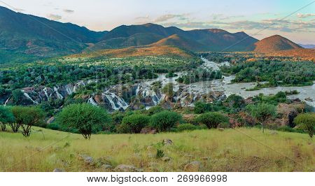 Epupa Falls On The Kunene River In Northern Namibia And Southern Angola Border. Sunset Sunlight With