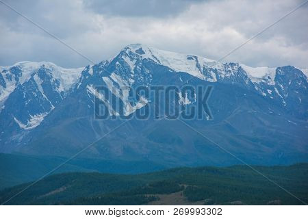 North-Chui ridge in Summer in Kurai steppe of Altai mountains, Russia. Cloud day.