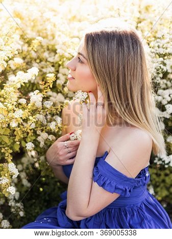 Sensual Calm Portrait Of Beautiful Hipster Woman In Blooming Bush With White Flowers Of Spirea. Copy