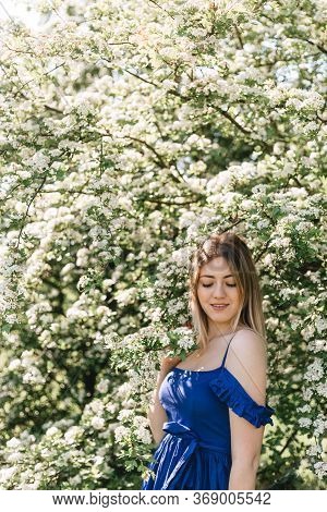 Sensual Calm Portrait Of Beautiful Hipster Woman In Blooming Bush With White Flowers Of Spirea. Copy