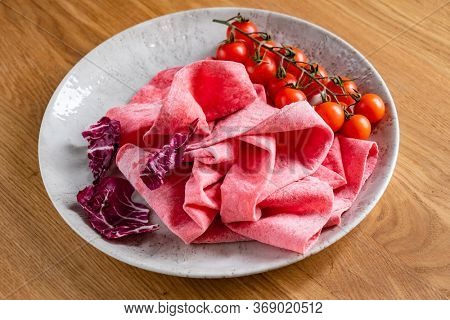 Lavash with tomatoes (soft, thin unleavened flatbread)