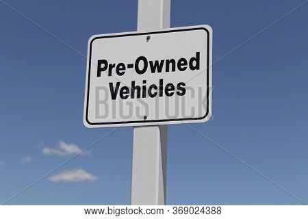 Pre Owned Vehicles Sign At A Used Car Dealership.
