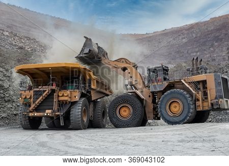 heavy machinery moving the kimberlite in an open pit mine in Botswana