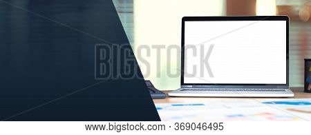 Laptop Computer Screen With Business Chart Market,caculator On Desk At Blur Modern Office .banner Mo