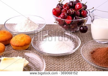 Ingredients For Making Homemade Cupcakes With Chocolate And Cherries. Classic Recipe For Making Dess