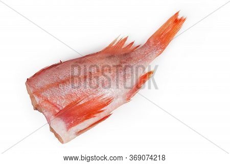 Raw Headless Gutted Carcass Of Redfish Also Known As Ocean Perch Or Norway Haddock On A White Backgr