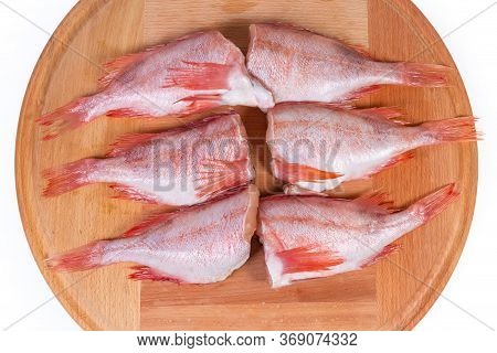 Raw Headless Gutted Carcasses Of Redfish Also Known As Ocean Perch Or Norway Haddock On The Round Wo