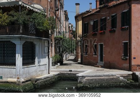 Venice, Italy - May 28 2016: Narrow Alley In Venice Waterfront