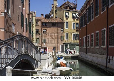 Venice, Italy - May 28 2016: Traditional Alley In Venice With Few People Around