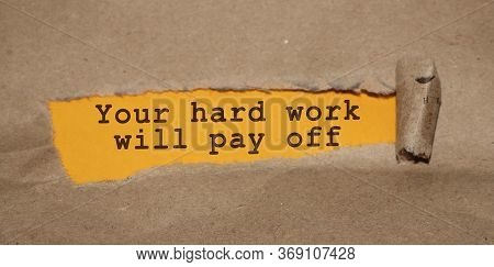 The Text Your Hard Work Will Pay Off Appearing Behind Torn Brown Paper. Business Startup Devepolment