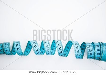 Blue Easuring Tape On The White Background With The Copy Space