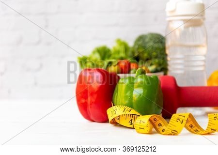 Diet Health Food And Lifestyle Health Concept. Sport Exercise Equipment Workout and gym Background W