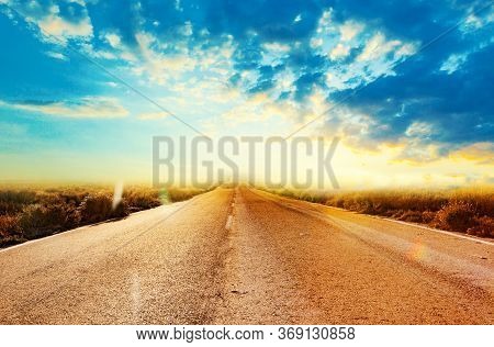 Car Travelling And Scenic Desert Road.adventures And Destination Concept.country Road Background And