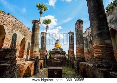 Buddha Statue In Old Temple In Inwa (ava) Near Mandalay In Myanmar (burma). Southeast Asia Travel Co