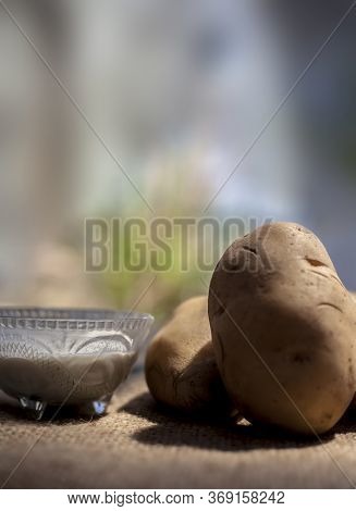 Potato And Egg White Face Mask To Achieve Natural Glowing Skin On A Brown Colored Surface With Raw P