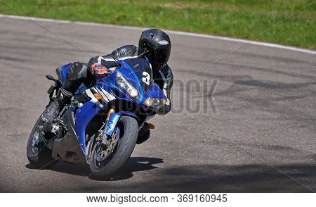 Motorcycle Practice Leaning Into A Fast Corner On Track.