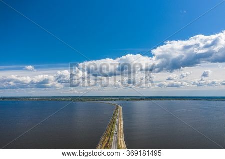 Aerial View Of The Amazing Big River With Dam Under Beautiful Cloudy Blue Sky. Europe, Ukraine, Krem