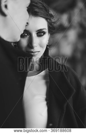 Close-up Portrait Of A Bride Hugging With The Groom. Beautiful Expressive Eyes. Wedding Couple On A 