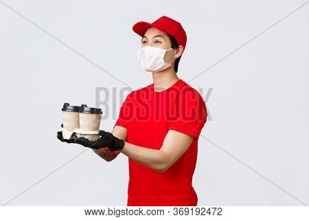 Here Is Your Order, Have Nice Day. Friendly Smiling Delivery Man, Fast-food Employee, Extend Hands A