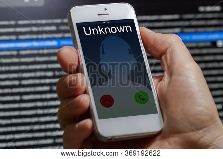 Unwanted Call To A Mobile Phone On A Dark Background