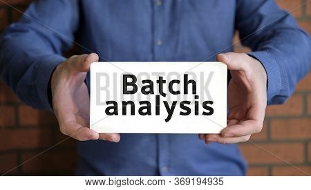 Batch Analysis - Seo Concept In The Hands Of A Young Man In A Blue Shirt