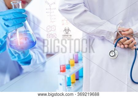 Doctor And Microbiologist With Vacuum Tubes For Samples With Covid 19 Infection Atypical Pneumonia V