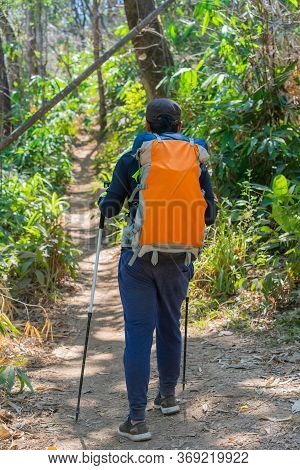 Traveler Man Hiking Enjoying In The Mountains With Backpack At Khao Chang Puak Mountain Thailand