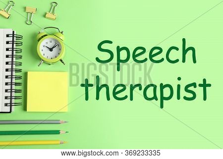 Modern Office Accessorises And Text Speech Therapist On Green Background, Flat Lay