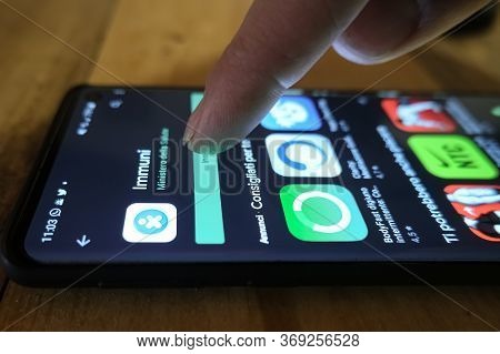 Rome, Italy - June 1 2020: Man Download New Italian Covid19 Contact Tracing App Immuni On Smarphone 