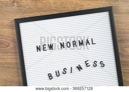 New Normal Business Text On White Letter Board Background. Adapting To New Life Post-lockdown Change