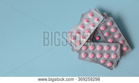 Pills Pink In A Pack On A Blue Background