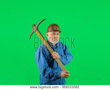 Bearded Man In Uniform Holds Pick Axe. Builder Man Holds Pickaxe. Craftsman Working With Pickaxe. Ma