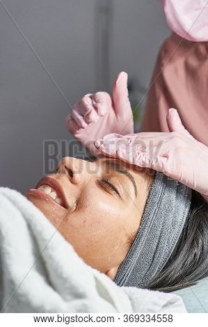 Face Skin Care. Close-up Of Woman Getting Facial Hydro Microdermabrasion Peeling Treatment At Cosmet